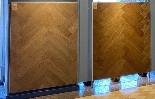 Two oak herringbone parquet panels in the showroom